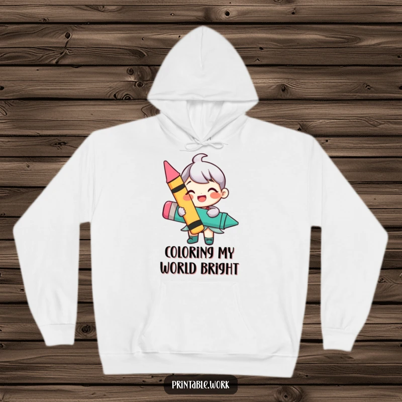 Funny hoodie showcasing a happy character enthusiastically holding a large, colorful crayon, designed for comfort and creative expression.