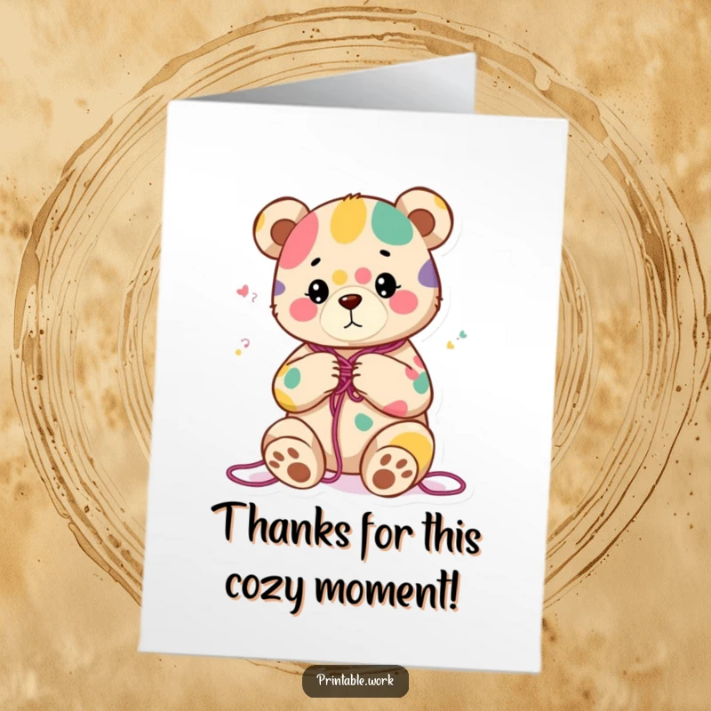 Funny Free Printable Thank You Card of a content bear knitting a colorful, abstract pattern, expressing thanks with warmth and creativity.